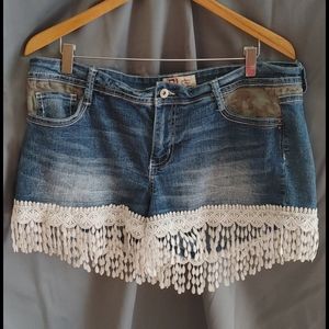 Blue jean shorts with white fringe